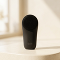 Wellora Silicone Facial Cleansing Scrubber photographed on a soft warm cream background with gentle daylight